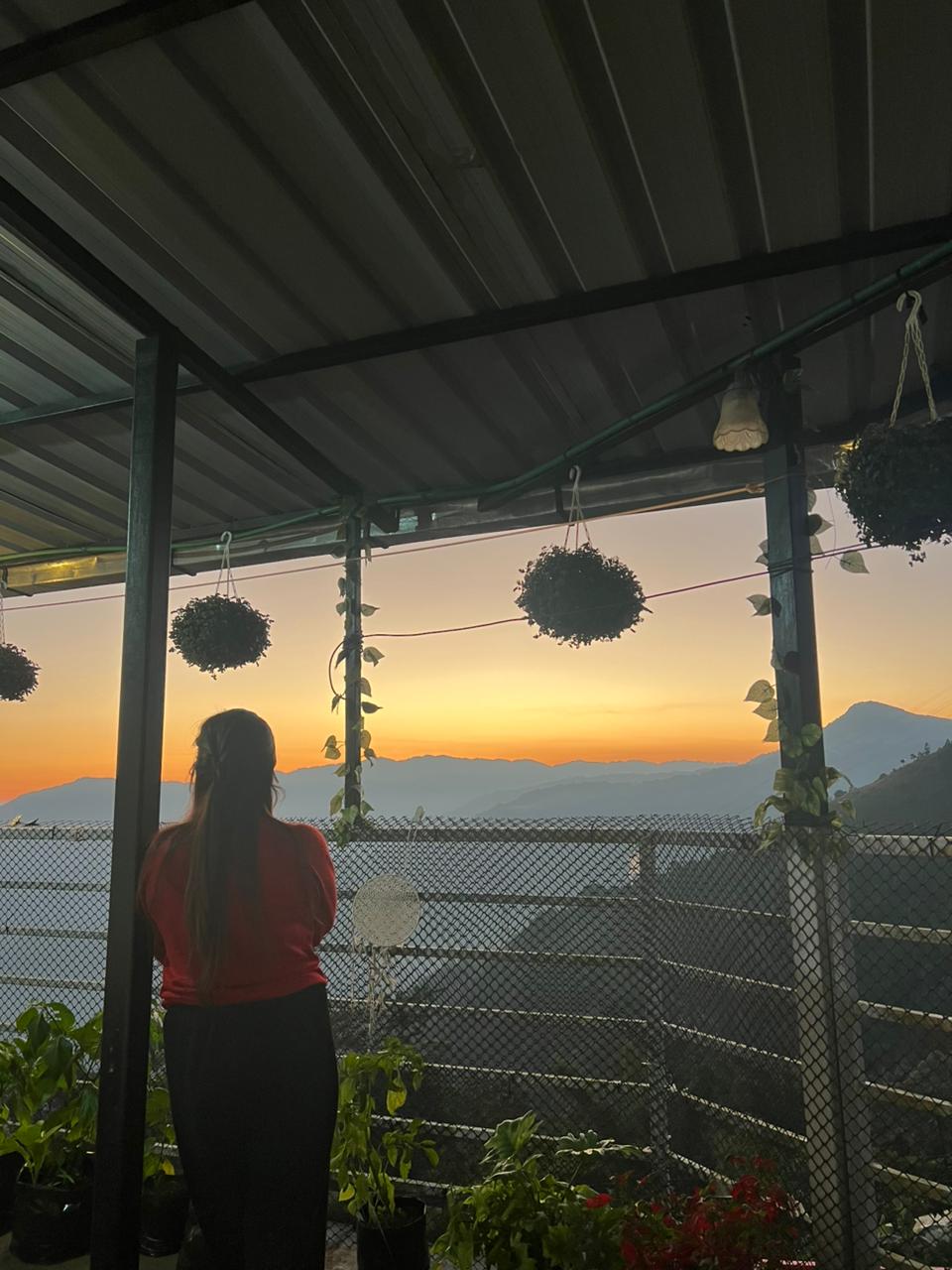 Guests enjoying balcony view at Chandrakala Homestay