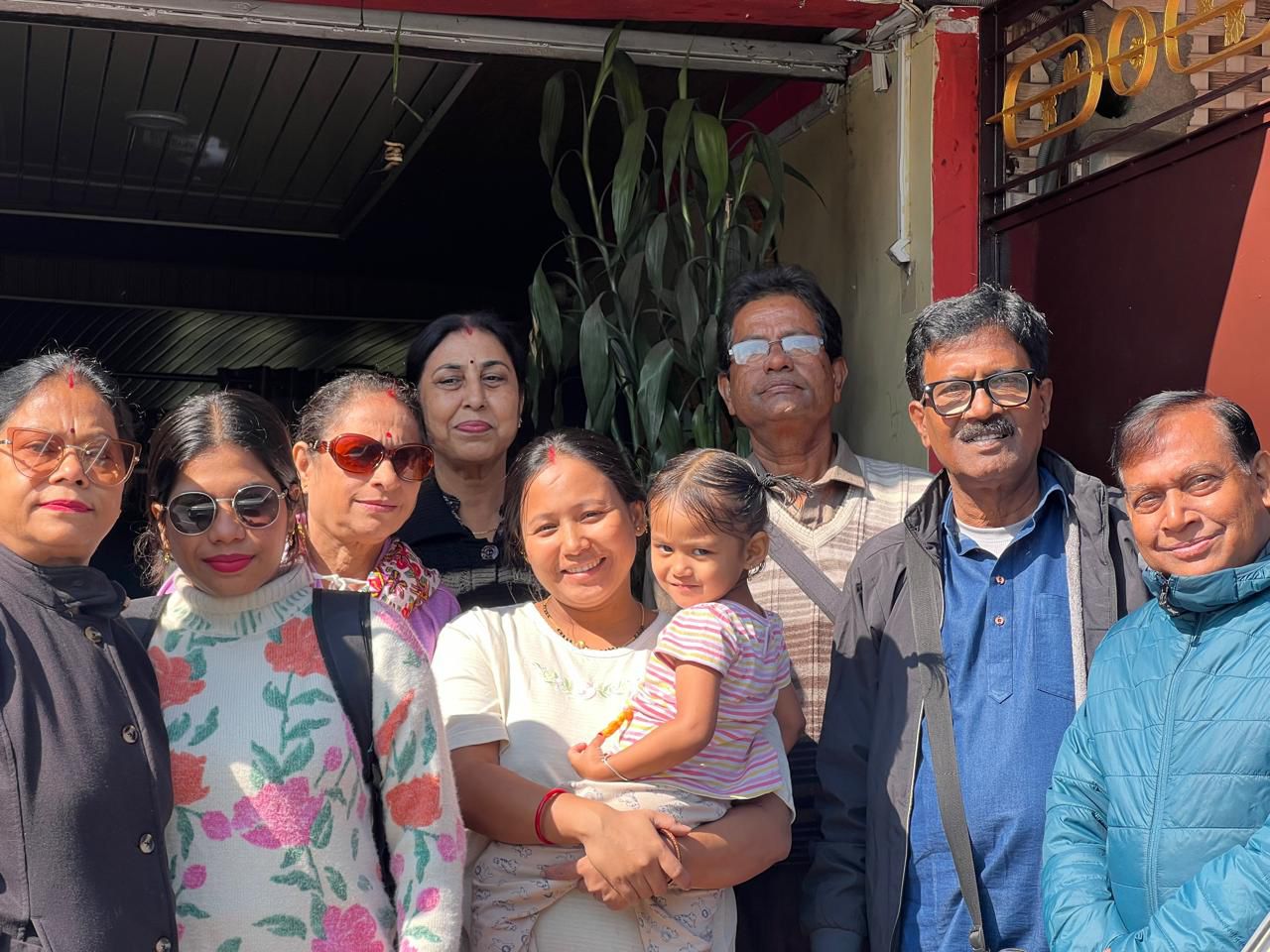 Photo with host family at Chandrakala Homestay